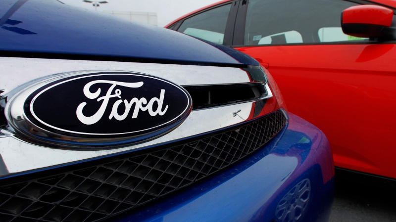 The Ford logo is seen on cars for sale at a Ford dealership, July 1, 2012. (AP / Seth Perlman)