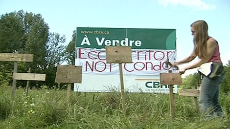A dozen West Island residents hammered symbolic stakes into L'Anse a L'Orme nature reserve Saturday in their fight to protect it from commercial development.