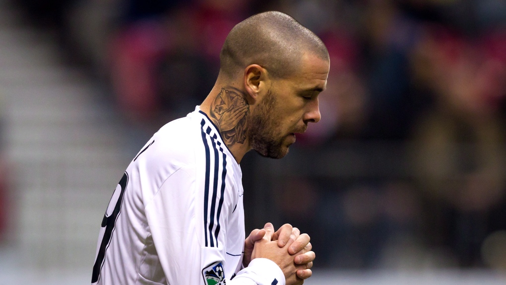 Vancouver Whitecaps' Eric Hassli, of France, reacts to a missed scoring chance against D.C. United d