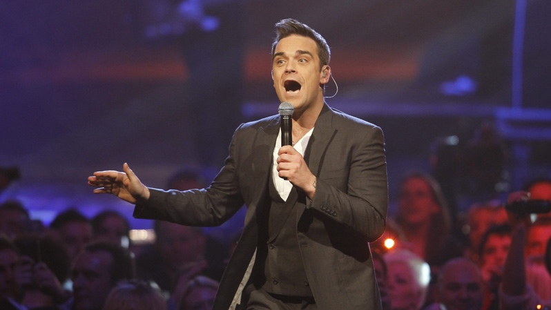British singer Robbie Williams performs during the Echo 2010 music award ceremony in Berlin, Germany, Thursday, March 4, 2010. (AP Photo / Markus Schreiber)