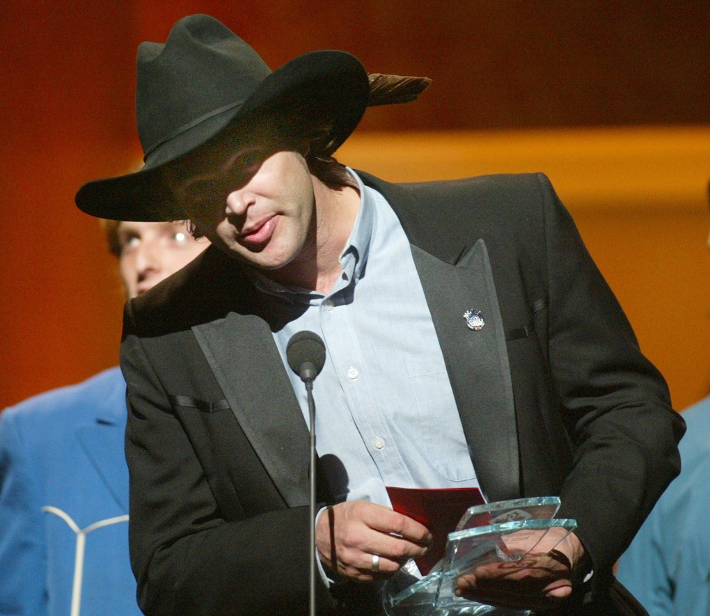 Corb Lund accepts his award for Roots Artist or Group of the Year during the Canadian Country Music 