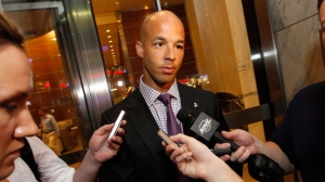 Manny Malhotra speaks to reporters after a negotiation session between the NHL Players' Association and the NHL, Wednesday, July 18, 2012, in New York. (AP Photo/Jason DeCrow)