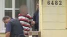 An unidentified man is arrested at a Halifax home in the city's west end on Aug. 1, 2012. 