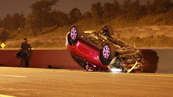 Police investigate at the scene of the crash on the 401 east-bound collector to transfer lanes near Port Union, Wednesday, Aug. 11, 2010. (Tom Stefanac / CTV News)   