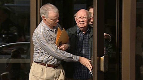 Former Catholic priest, Kenneth O'Keefe, (right) is seen leaving the Ottawa courthouse, Wednesday, Aug. 11, 2010.
