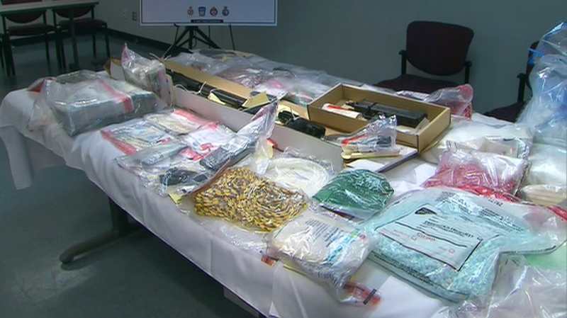 Seized drugs and weapons are seen following a major drug bust by Peel Police in Toronto, Thursday, Aug. 12, 2010.