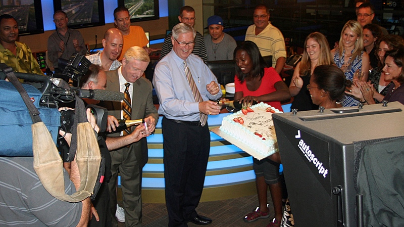 The CTV News crew sends Jim Junkin off with champagne and cake on Friday, Aug. 13, 2010. (Ian Caldwell/CTV Toronto)