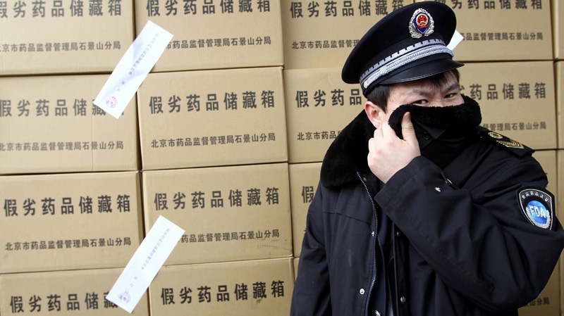 Chinese Food & Drug Administration with more than 50 tons of confiscated fake medicine in Beijing.