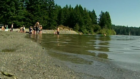 Swimmers enter Westwood Lake, near Nanaimo, shortly after a seven-year-old girl drowned. Aug. 13, 2010. (CTV)