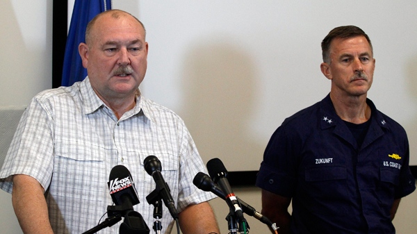 National Incident Commander Thad Allen, left, speaks at a news conference with U.S. Coast Guard Rear Admiral Paul Zukunft where Allen urged that crews must move forward with the drilling of the Deepwater Horizon relief well in the Gulf of Mexico in Schriever, La., Friday, Aug. 13, 2010. (AP  / Patrick Semansky)