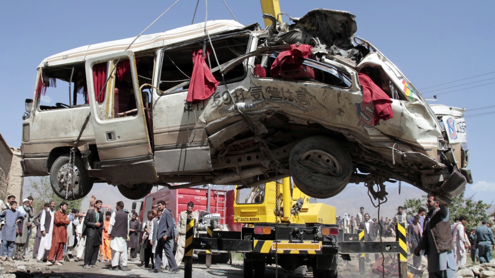 Damaged bus, remote control bomb, Afghanistan