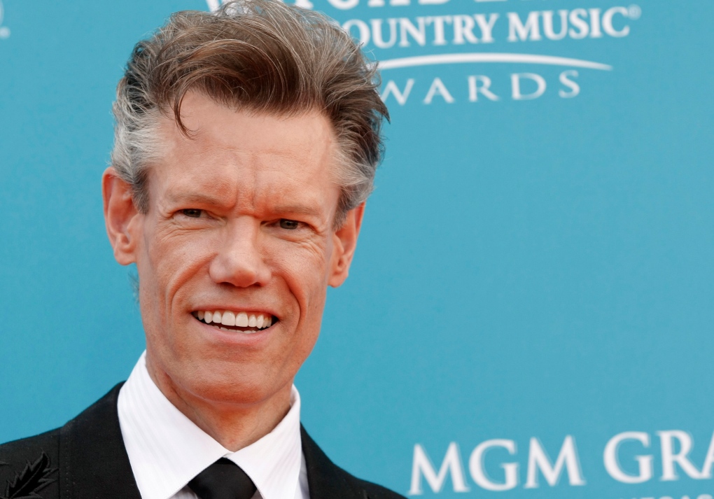 Randy Travis arrested after found naked at scene of car 