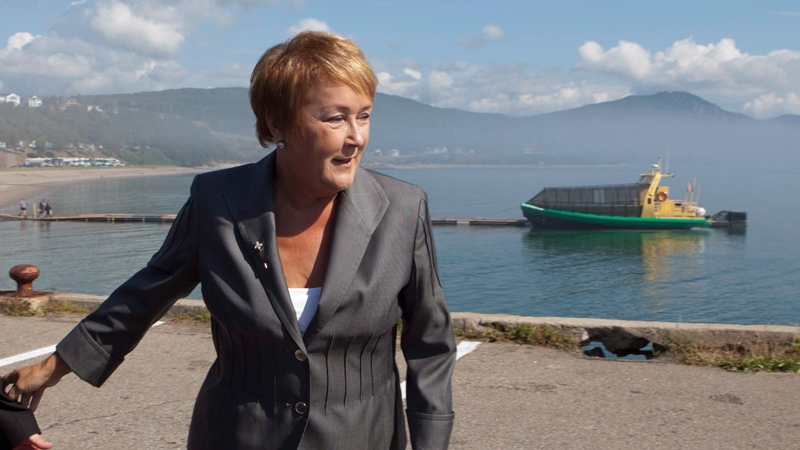 Parti Quebecois Leader Pauline Marois walks to a news conference on a wharf in Saint-Simeon, Quebec,