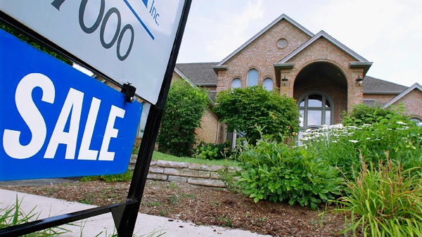 A "For Sale," sign is displayed outside a home in Springfield, Ill., July 15, 2010. (AP / Seth Perlman)