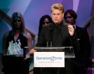 Joe Simpson speaks at the Operation Smile "Smile Gala" in Beverly Hills, Calif. on Friday, Oct. 2, 2009. (AP / Dan Steinberg)