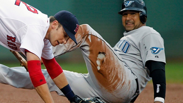 Toronto Blue Jays' Jose Molina, right, is out at second base as Boston Red Sox's Jed Lowrie gets up after turning the double play in the fifth inning of a baseball game in Boston, Sunday, Aug. 22, 2010. (AP / Michael Dwyer)