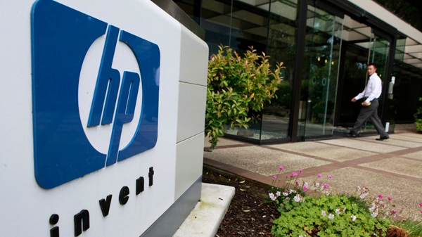 A worker arrives at Hewlett Packard Company headquarters in Palo Alto, Calif. in this June 1, 2010 file photograph. (AP / Paul Sakuma)