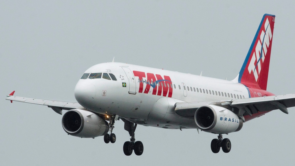 A TAM airline plane approaches the runway of Rio de Janeiro's Santos Dumont airport in Brazil, Thurs