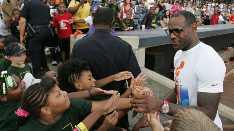 LeBron James greets kids at Canal Park in Akron, Ohio on Aug. 19, 2012.