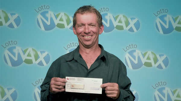 Gerald Clement, 50, celebrates his $25-million Lotto Max win at the Ontario Lottery and Gaming Corp. prize centre in Toronto, Tuesday, Aug. 24, 2010.