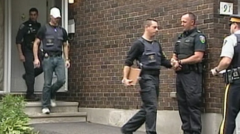 RCMP officers conduct a raid as part of a terror investigation in Esterlawn Private in Ottawa's west end, Wednesday, Aug. 25, 2010.