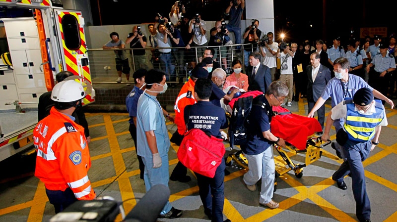 Jason Leung, identified by Canadian media as a Canadian citizen, one of the tourist survivors who was injured in Monday's hostage crisis in Manila, arrives at a hospital in Hong Kong, Thursday, Aug. 26, 2010. (AP / Kin Cheung)