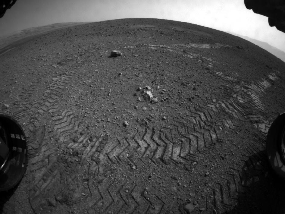 This image shows the tracks left by NASA's Curiosity rover as it completed its first test drive