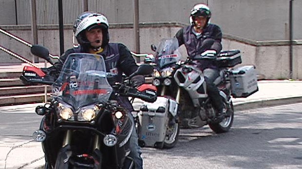 Stephane Etienne is being joined by Aymeric Zito on a mission to ride a motorcycle around the world. They're pictured here in Ottawa Thursday, Aug. 23, 2012.