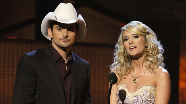 In this Nov. 11, 2009 file photo, Brad Paisley and Carrie Underwood host the 43rd Annual Country Music Awards in Nashville, Tenn. (AP Photo/Mark Humphrey, file)
