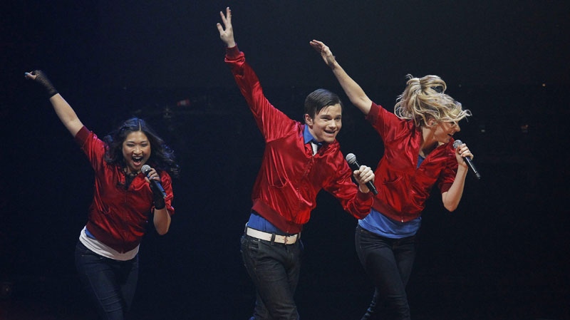 Jenna Ushkowitz, left, Chris Colfer, middle, and Heather Morris, members of the cast of the popular television show "Glee" perform during a concert to kickoff a national "Glee" tour at the Dodge Theatre Saturday, May 15, 2010, in Phoenix. (AP Photo/Ross D. Franklin) 