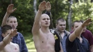Skinheads give the Nazi salute during their training outside Moscow, in this June 16, 2004 file photo. (AP Photo/Sergey Ponomarev)