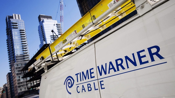 In this Feb. 2, 2009 file photo, a Time Warner Cable truck is parked in New York. (AP Photo/Mark Lennihan, file)