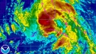 Tropical Storm Isaac is shown moving toward southern Florida in this enhanced NOAA satellite image taken at 3:15 a.m. ET on Sunday, Aug. 26, 2012. (NOAA)