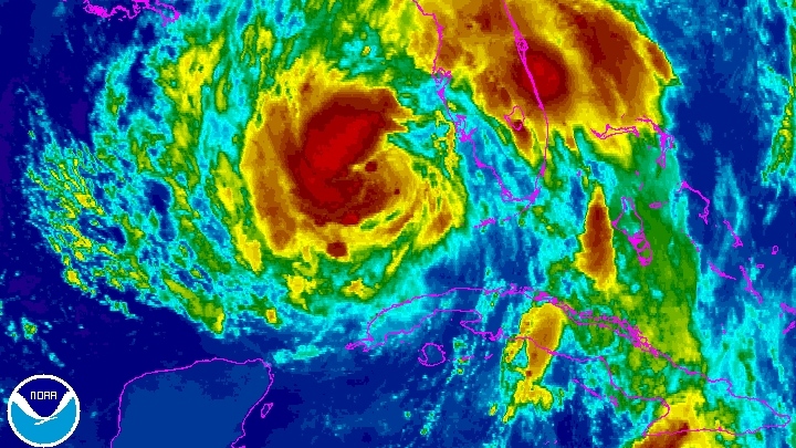 Tropical Storm Isaac churns in the Gulf of Mexico as seen in this enhanced NOAA satellite image take