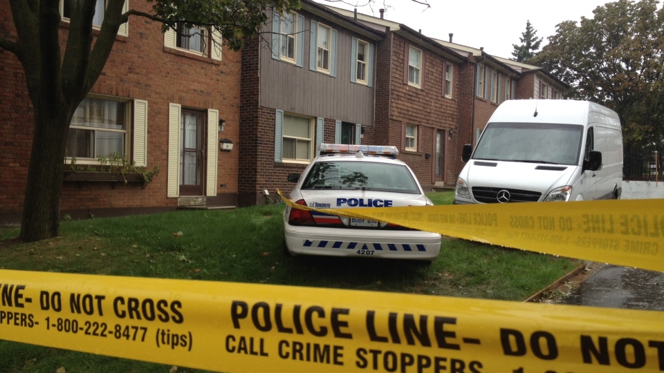 Police are shown at the townhouse of Chunqui Jiang in Scarborough, Ont.