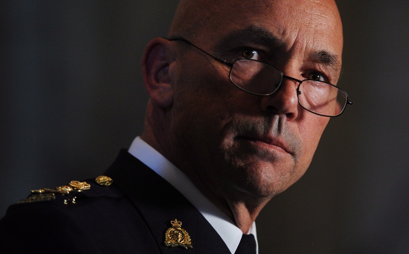 RCMP Commissioner Bob Paulson takes part in a press conference in the foyer of the House of Commons on Parliament Hill in Ottawa on Wednesday, June 20, 2012. THE CANADIAN PRESS/Sean Kilpatrick
