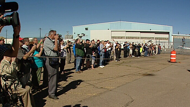 Dozens of aviation fans gathered to watch as a World War II-era plane touched down in Edmonton on Th