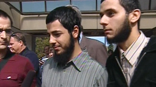 Twenty-year-old Awso Peshdary (centre) leaves the Ottawa courthouse after he was freed on bail, Friday, Sept. 3, 2010