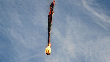 A hot air balloon's basket is engulfed in flames shortly after takeoff when it was about 25 feet off the ground in Surrey British Colombia Canada, in this Aug. 24, 2007, file photo. Witnesses said passengers screamed and jumped to the ground. The balloon reportedly took off from a grassy field with 12 passengers. The balloon crashed in a trailer park and campground , injuring as many as 11 people, police and local reports said. Two additional people were unaccounted for. (AP Photo/Don Randall/FILE)