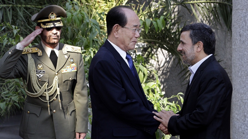 Iran's Mahmoud Ahmadinejad, right, welcomes North Korea's Kim Yong-nam to Tehran, on Sept. 1, 2012.