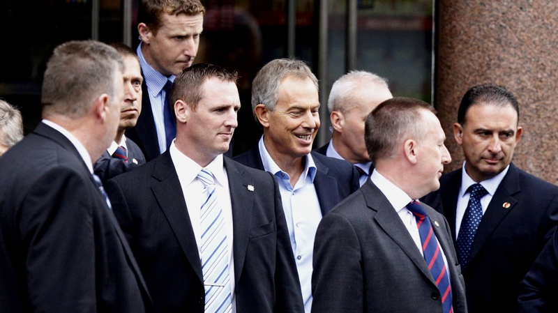 Former British Prime Minister Tony Blair, center, leaves a public book signing at the Eason book store, in Dublin, Saturday Sept. 4, 2010. (AP / Peter Morrison)