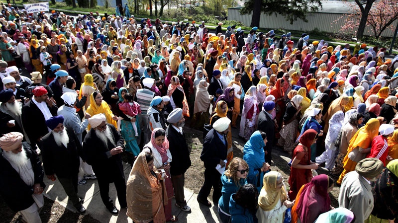 People walk in the Vaisakhi parade in Vancouver, B.C., on Saturday April 10, 2010. (THE CANADIAN PRESS/Darryl Dyck)