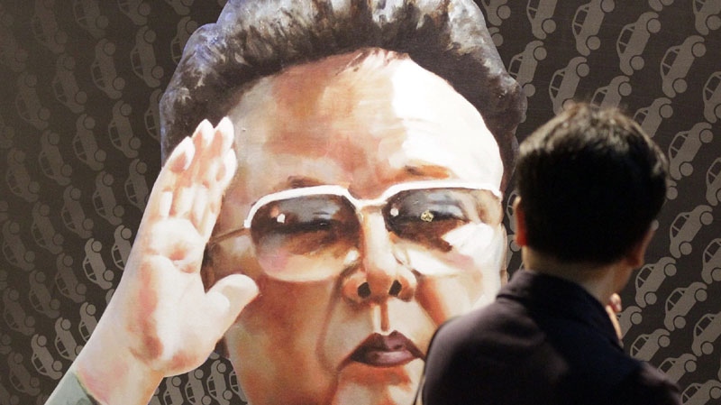 A tourist looks at a poster of North Korean leader Kim Jong Il, painted by North Korean defector Sun Moo, at the Korea War Memorial Museum in Seoul, South Korea, Tuesday, Sept. 7, 2010. (AP Photo/ Lee Jin-man)