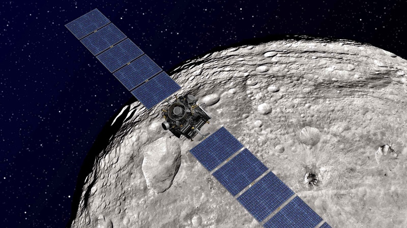 Undated artist rendering shows the NASA Dawn spacecraft in orbit around Vesta.