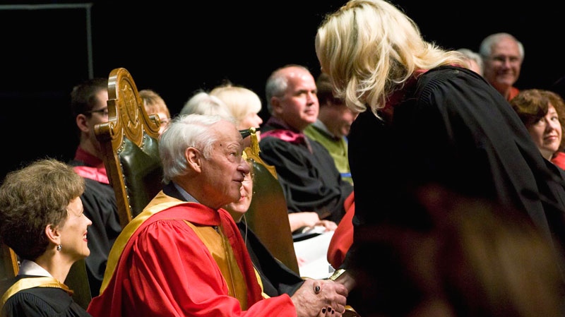 NHL legend Gordie Howe shakes hands with a recent graduate during graduation ceremonies at TCU Place in Saskatoon, on Thursday, June 3, 2010. (Liam Richards / THE CANADIAN PRESS)