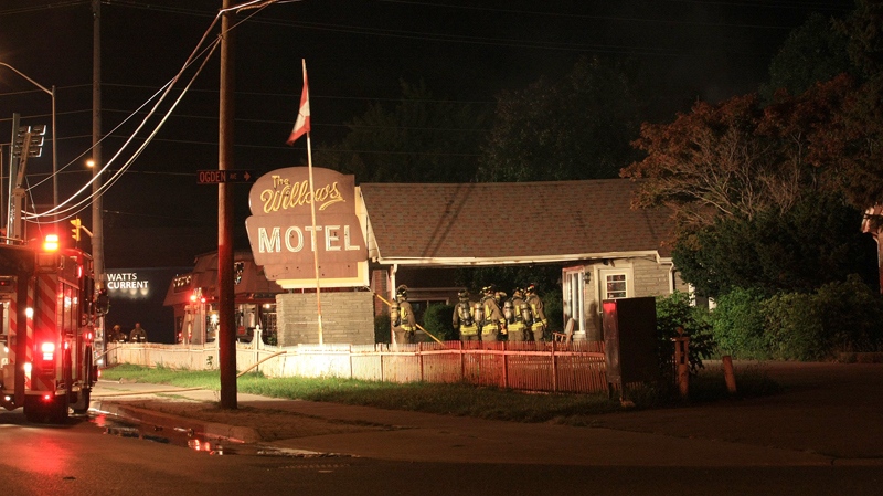 Firefighters are seen at The Willows Motel, at Lake Shore Road East and Ogden Avenue, following an early morning blaze, Wednesday Sept. 8, 2010. (Tom Stefanac / CTV News)