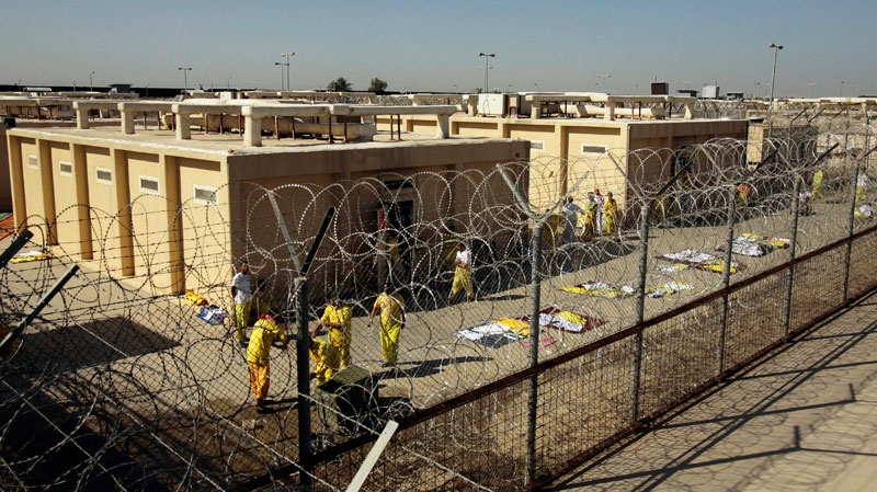 Detainees are seen outside their cell block at the U.S. detention facility at Camp Cropper in Baghdad, Iraq. Four prisoners with links to al-Qaida have escaped from the U.S.-controlled part of a maximum-security prison in Baghdad, U.S. and Iraqi officials said Thursday, Sept. 9, 2010. (AP / Maya Alleruzzo)