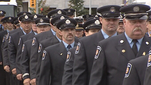 Ottawa Fire Services members march in a parade en route to honour fallen firefighters Friday, Sept. 7, 2012.