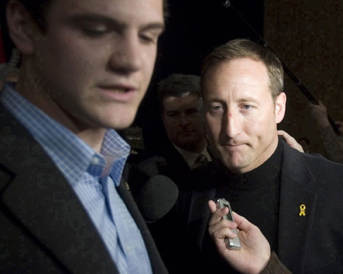 Defence Minister Peter MacKay is escorted away from journalists by a member of the Prime Minister's Office staff prior to the start of the federal Conservative Caucus meeting in Ottawa on Friday, Jan. 25, 2008. (Tom Hanson / THE CANADIAN PRESS)