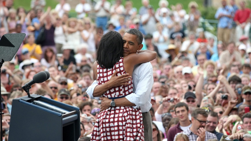 U.S. President Barack Obama and his wife embrace in Dubuque, Iowa on Aug. 15, 2012.